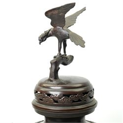 Japanese late Meiji period bronze koro and cover, surmounted by an eagle finial and with bird decoration in high relief to each side, twin elephant trunk handles, bearing indistinct character signature to one side, H82cm