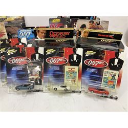 Corgi - The Definitive Bond Collection and The Director's Cut - nine die-cast vehicles from You Only Live Twice, Goldfinger, For Your Eyes Only, Diamonds Are Forever etc; Corgi Classics Moonraker Shuttle and Lotus Esprit; two other Corgi James Bond packs; Carrera Die Another Day Aston Martin V12 Vanquish; nine Johnny Lightning carded James Bond vehicles; Dragon carded Wai Lin figure; and three Fabbri tanks; all boxed/packaged (27)