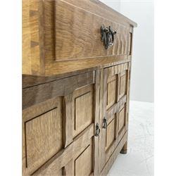 'Acornman' adzed oak sideboard, fitted with two drawers and two cupboards enclosed by panelled doors, all over adzing, by Alan Grainger of Brandsby 