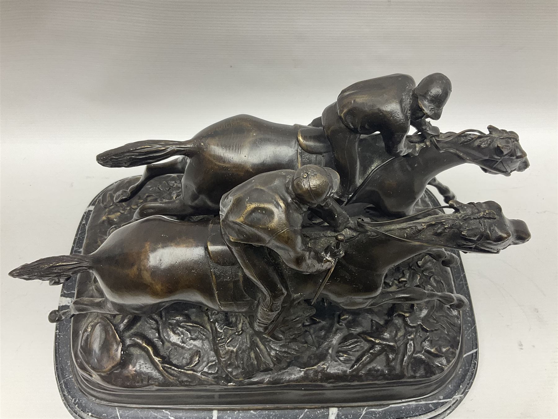 After E Loiscay, bronzed figure group, modelled as two race horses, signed E Loiscay, upon a stepped marble plinth, overall H28cm