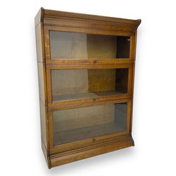 Early 20th century oak three-tier stacking library bookcase, enclosed by hinged and sliding glazed doors