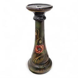 Early 20th century mahogany torchère and ceramic jardinière, circular dished top with carved leaf moulded edge, on ring turned and tapering column raised on tripod splayed supports, together with a hand-painted ceramic jardinière stand decorated with roses on a green ground (Torchère H 122cm, W 31cm, Jardinière H 71cm, W 30cm)