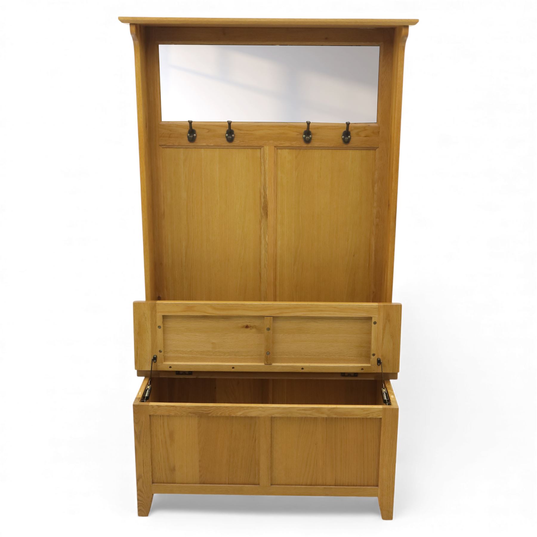 Modern light oak hall bench settle, with moulded cornice above a panelled back fitted with a row of metal coat hooks, over a hinged box seat opening to shoe storage, on tapered legs