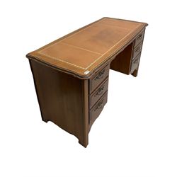 Younger Furniture - cherry wood desk, the shaped top with leather inset, fitted with six drawers