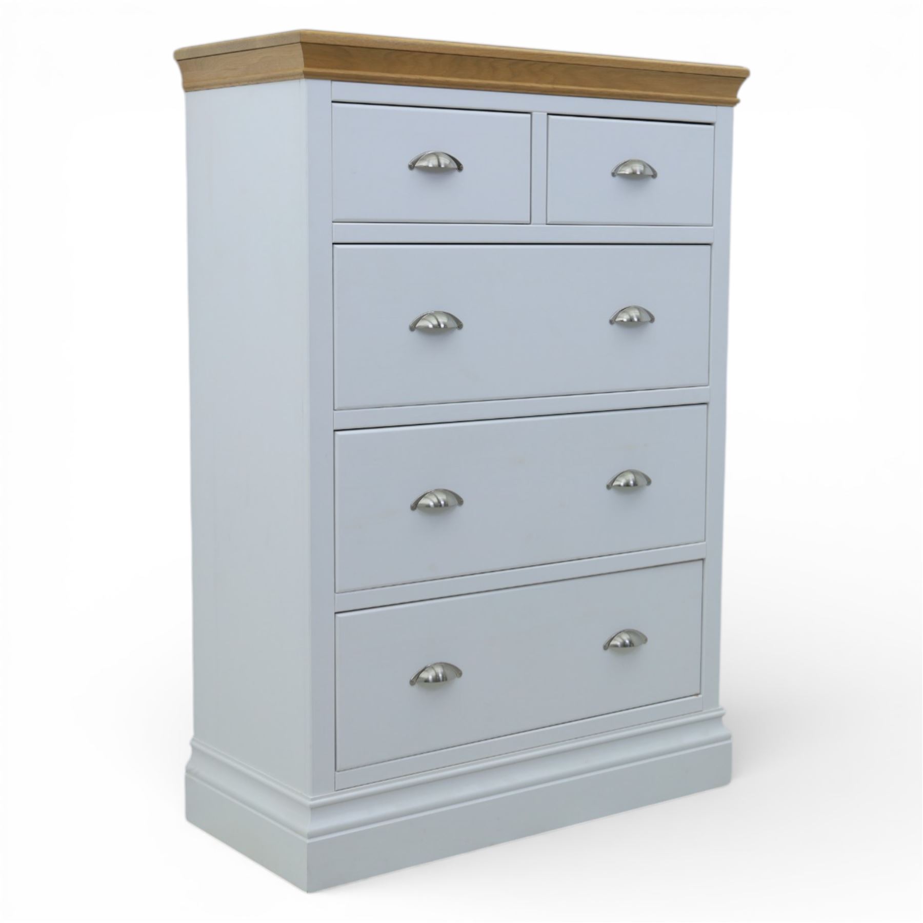 Modern chest of two short and three long drawers in white finish with oak moulded top, with metal cup handles, raised on a moulded plinth base