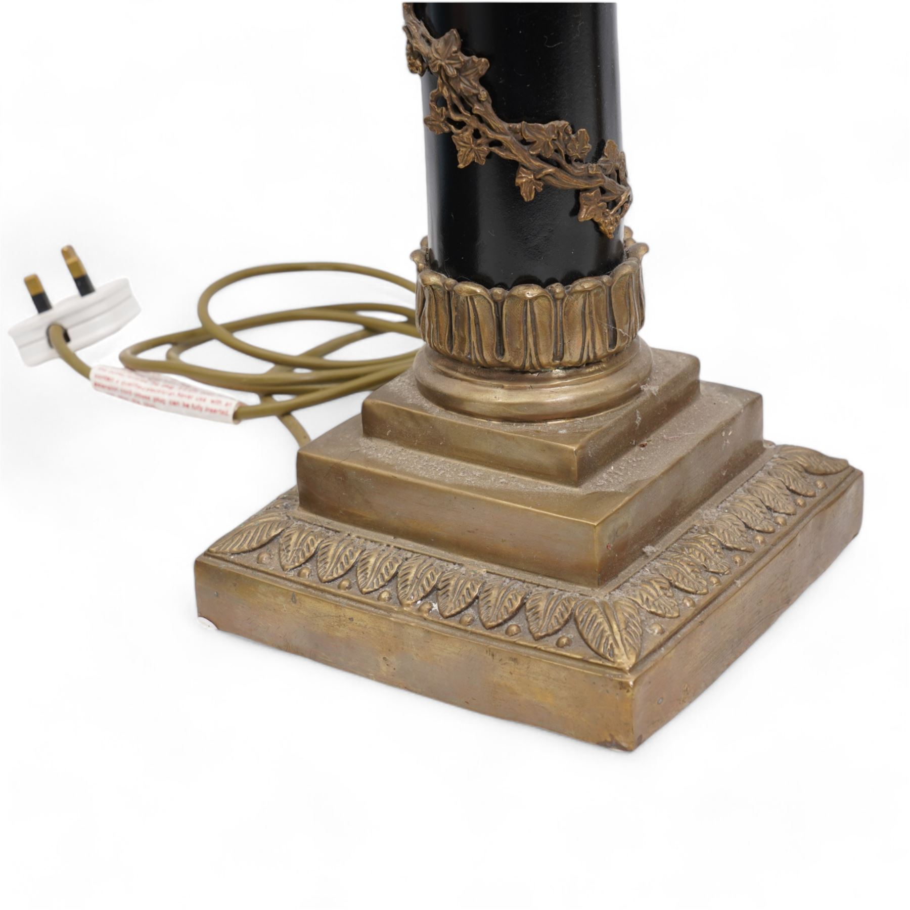 Victorian copper and brass fire hose branch, converted to a table lamp, on circular wooden plinth, H63cm together with a 20th century brass and ebonised corinthian column table lamp, with vine entwined stem and leaf cast square base, both with mottled glass shades (2)