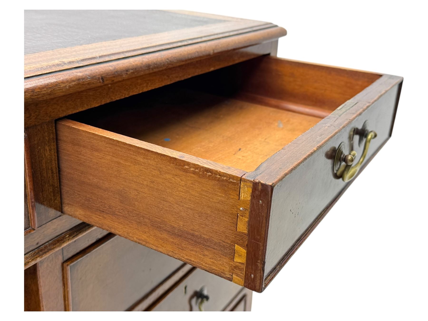 Edwardian mahogany twin pedestal desk, rectangular burgundy leather top moulded edge, over three short drawers with brass swan neck handles, over twin pedestals with graduating drawers supported on bracket feet