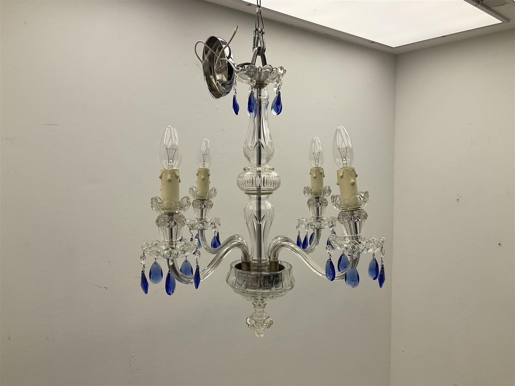 Glass four light chandelier, the baluster shaped central glass column supporting four curved branches with drip pans and blue glass drops, approx height excl fitting H50cm