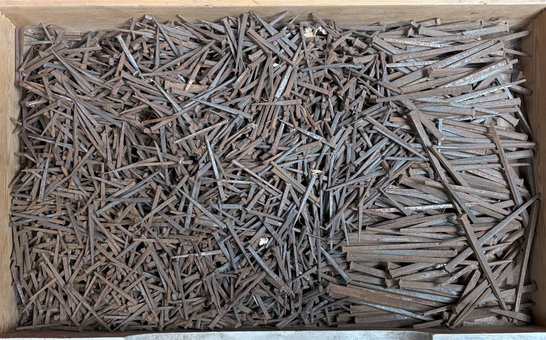 Large quantity of unused hand forged cut nails, 19th century.  - COLLECTION BY APPOINTMENT FROM: The White House, Thirsk Road, Easingwold, York, YO61 3NF - CALL 01723 507111 TO ARRANGE