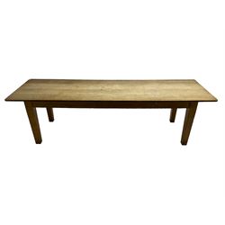 Early 20th century oak dining table, rectangular top raised on square tapering supports 