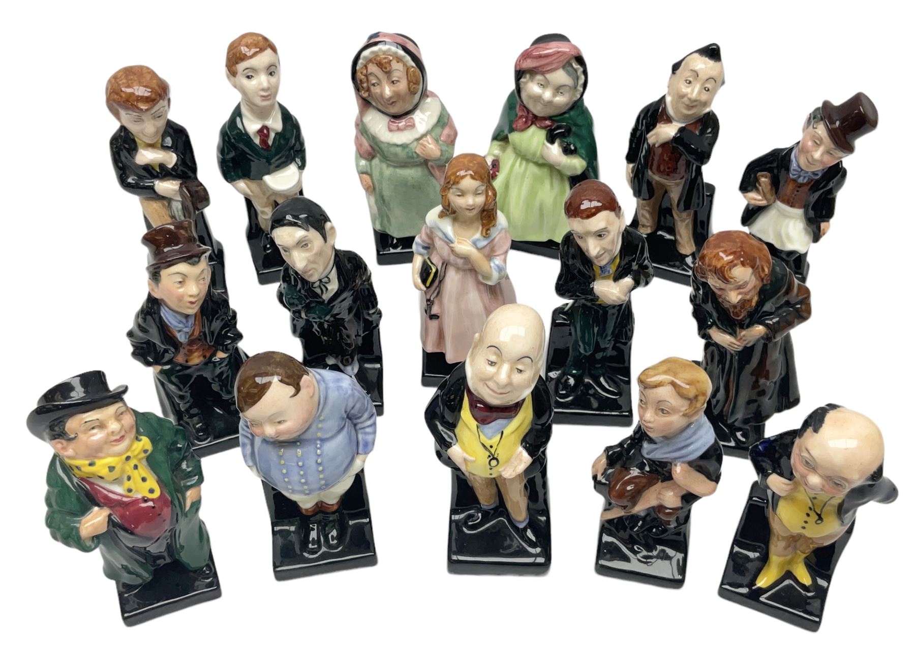Sixteen Royal Doulton Charles Dickens figures, to include Oliver Twist, Fat Boy, Fagan, Stiggins etc, all with printed marks beneath