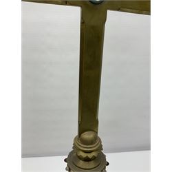 Brass alter cross, decorated with glass cabochons, upon a acicular stepped base and three claw feet, H73cm 