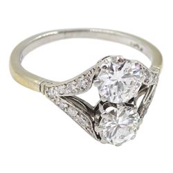 Early-mid 20th century two stone diamond ring, with diamond set shoulders, stamped Plat, each larger diamond approx 0.70 carat, total diamond weight approx 1.50 carat
