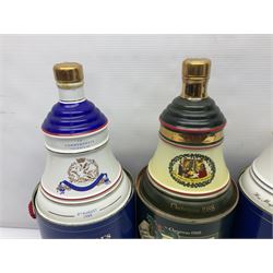 Bells, Scotch whisky, in seven Wade ceramic decanters, including Christmas 1988, 1989, 1990, 1991 etc
