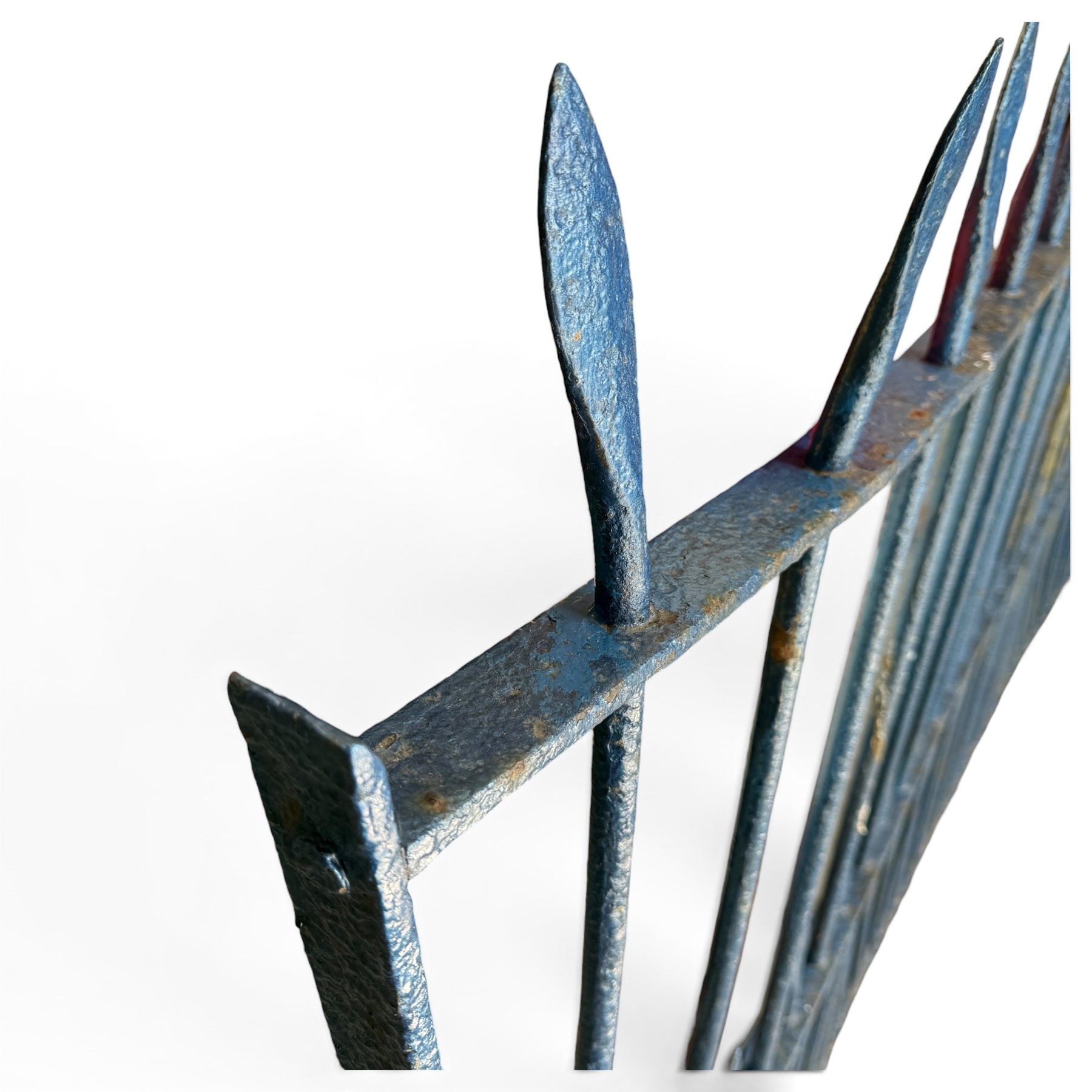 Two sections of painted iron garden or estate boundary railing, comprising a 19th century wrought iron section with graduated spearhead uprights, together with a later hoop-top section with ball-finial end posts, both in blue painted finish