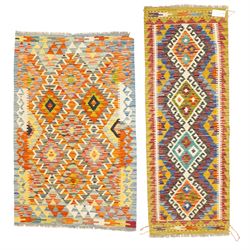 Afghan Chobi flatweave kilim and an Afghan Chobi flatweave kilim runner, with a repeating ...