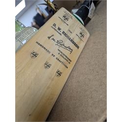 Two signed cricket bats, with signatures including Colin Cowdrey