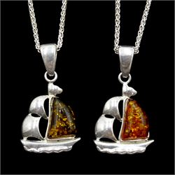 Two silver Baltic amber boat pendant necklaces; one orange and the other green coloured amber, stamped 925 (2) 