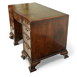 Early 20th century inlaid mahogany pedestal kneehole desk, rectangular top with inset tooled leather writing surface, over an arrangement of nine drawers with brass swan neck handles, on ogee bracket feet