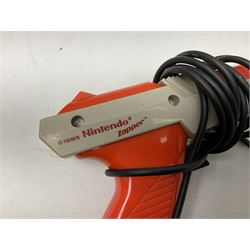 Nintendo Entertainment System (1985) console with two controllers, accessories and instruction booklet. NES Games ‘Duck Hunt’ with Nintendo Zapper gun, ‘Pinball’ and ‘Super Mario Bros.’, all with original sleeves and instruction booklets. NES game ‘Super Mario Bros. 2’ cartridge only