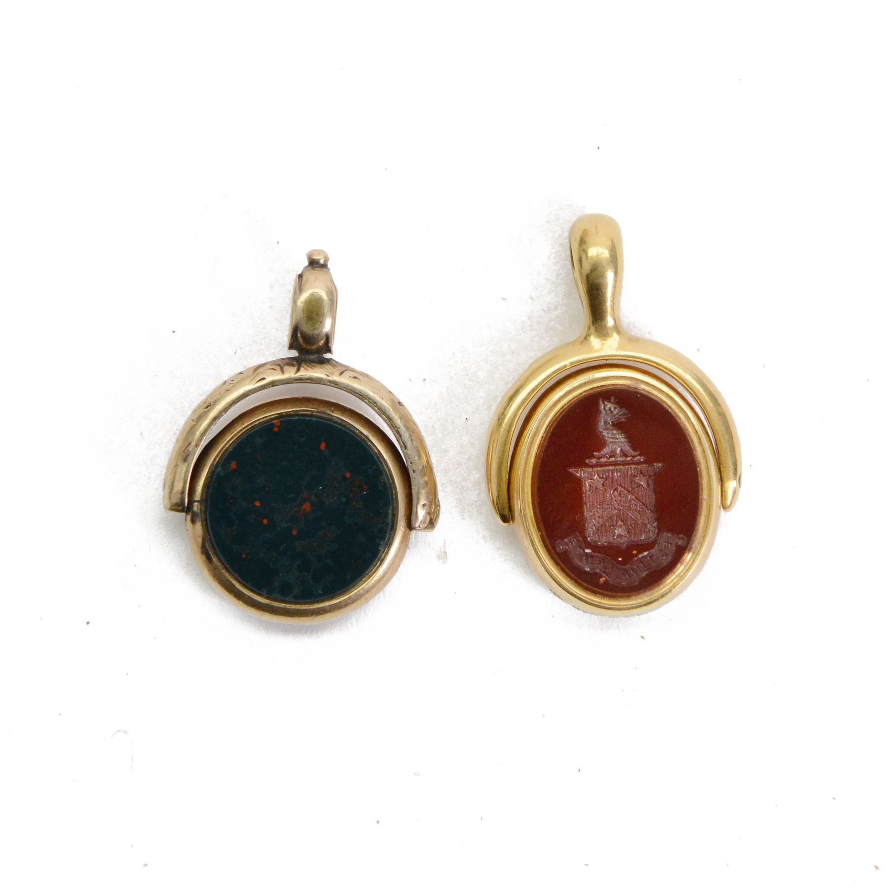 Two 19th century gold swivel fobs, the first 18ct example set with bloodstone and carnelian engraved with monogram and armorial, bearing hallmarks, the second 9ct example with bloodstone and chalcedony, set within simple mounts, each approximately H3cm 

Provenance: By family descent from the Chichesters of Arlington Court, Devon; from the collection of Andrew Chichester Everitt.
