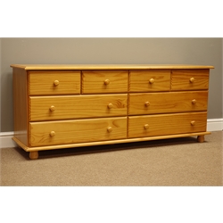  Polished pine chest fitted with eight drawers, W160cm, H65cm, D43cm  