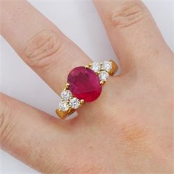 18ct gold ruby and diamond ring, single oval cut ruby of approx 5.35 carat, with three round brilliant cut diamonds set either side, stamped, total diamond weight approx 1.00 carat