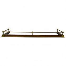 Three 20th century brass fenders, two with pierced Art & Crafts design rails, largest W156cm, D 45cm 