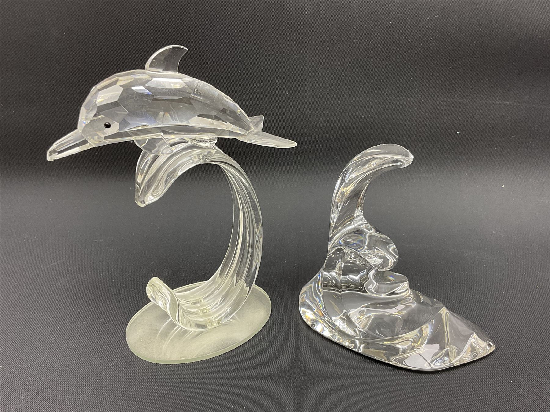 Nineteen Swarovski Crystal sea creatures, to include dolphins, seals, puffer fish, octopus, crabs, together with a quantity Swarovski Crystal shells 