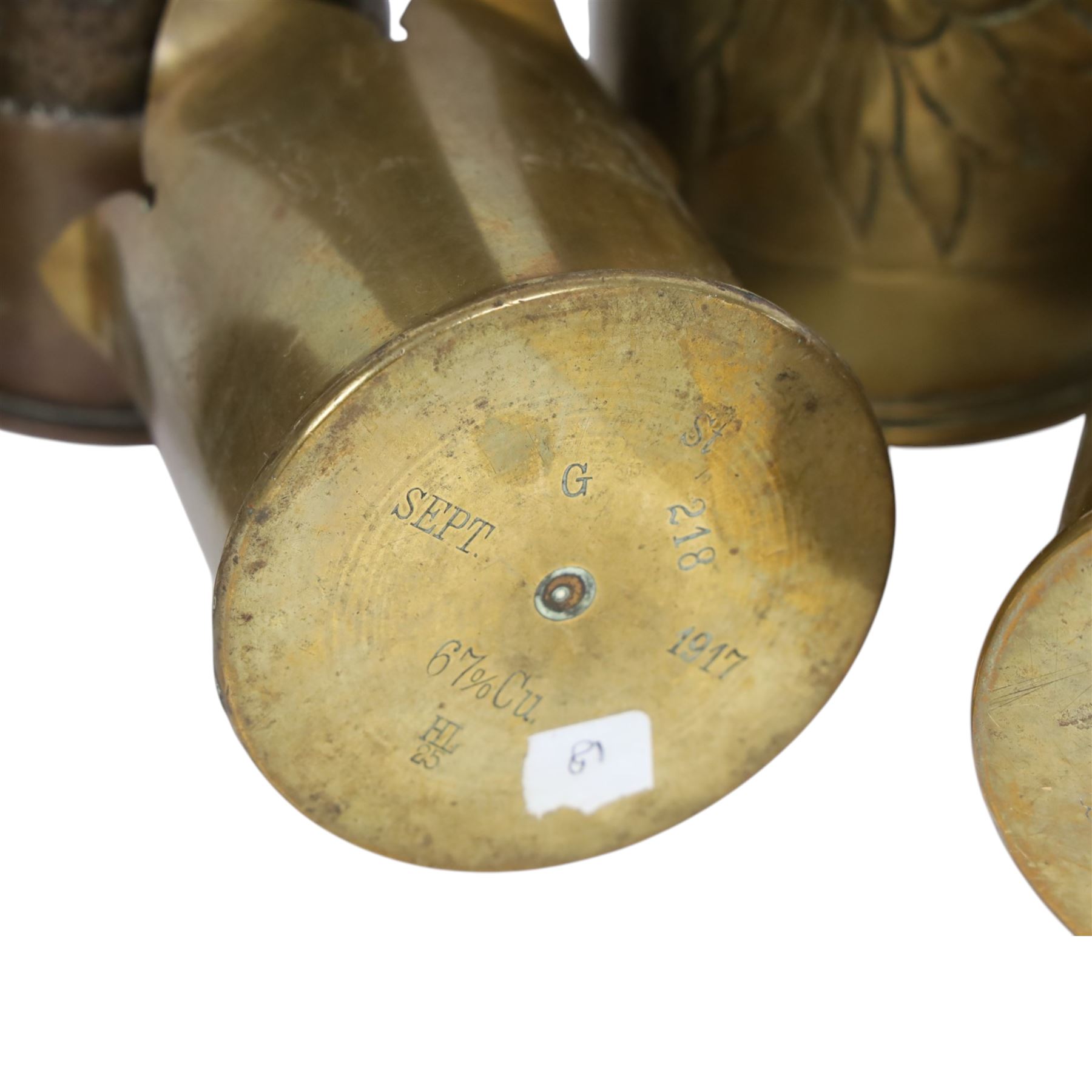Eleven tench art shell case vases, including examples decorated in relief, with flowers, largest H30cm