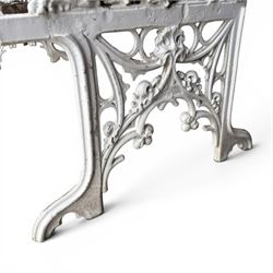 Coalbrookdale Gothic design cast iron and slatted teak garden bench, the ornate pierced back and sides of arched design, with central cartouche shield surrounded by stylised crosses and trefoils with interspersed flowerheads, the scrolled arm terminals with stylised griffon motifs and trailing fruiting vines 