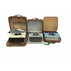 Three vintage portable typewriters comprising Olympia Splendid 99, Olympia Splendid 66 and Erika, all in tan carry cases (3)