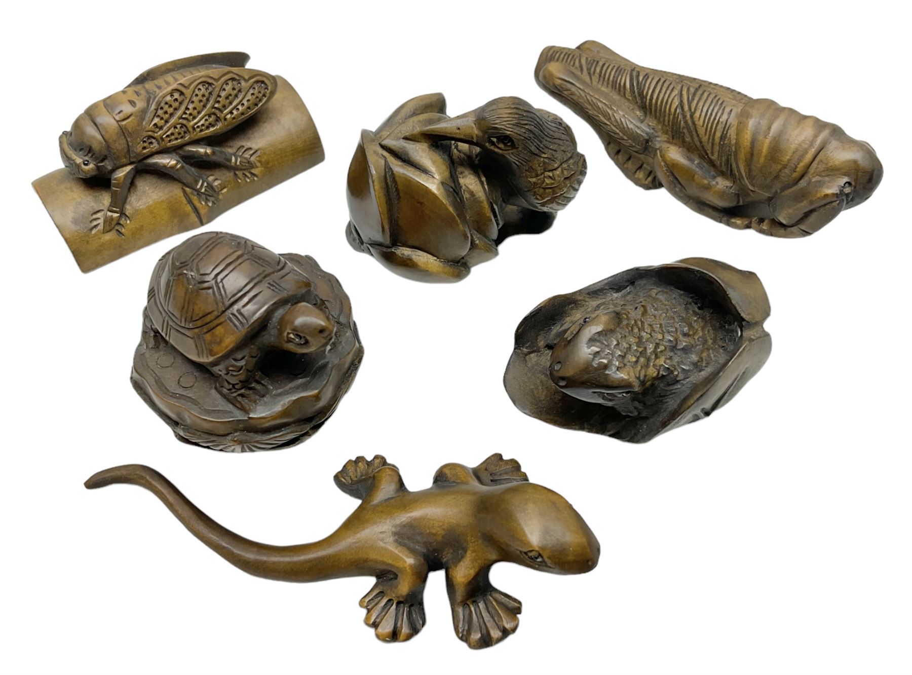 Six netsuke, modelled as a lizard, cricket, frog, bird on a flower, turtle and insect
