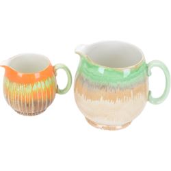 Four pieces of Shelley Harmony dripware, comparing ginger jar and three jugs, largest jug H23cm