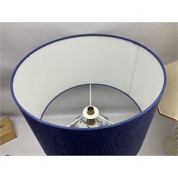 Modern pierced oriental white ceramic vase shaped table lamp, together with a blue and white baluster shaped example decorated with figures upon elephants, both with shades, tallest H83cm incl shade