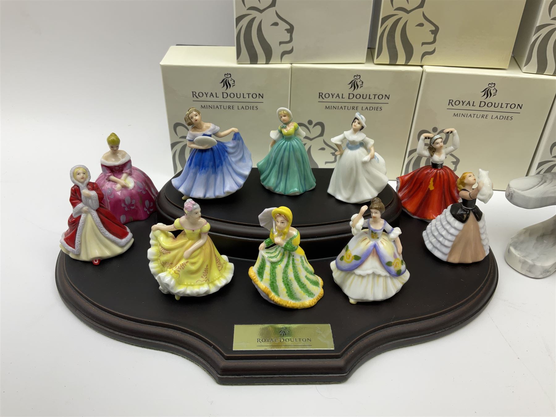 Six Royal Doulton Pretty Ladies figures, comprising Rebecca, Belle, Deborah, Jennifer, Jessica, and Lauren, with display stand, together with ten Royal Daulton Miniature Ladies figures, Ninette, Christine, Rachel, Elizabeth, Margret, Karen, Elaine, Victoria, Jane, and Susan, with display stand, all with boxes. 
