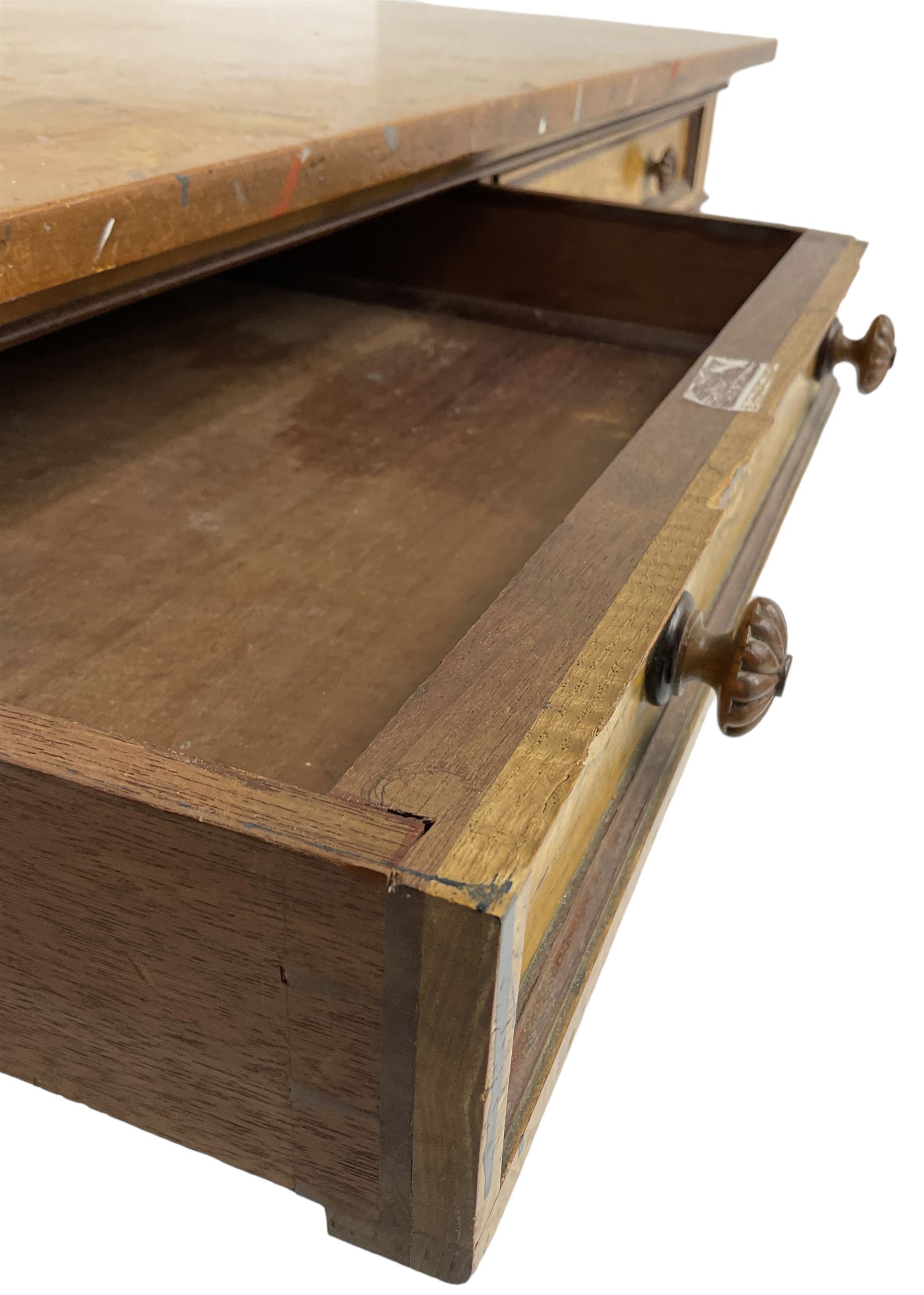 19th century walnut side table, rectangular top over two drawers with elm facias, lobe carved handles and moulded edge in mahogany, on turned and fluted supports 