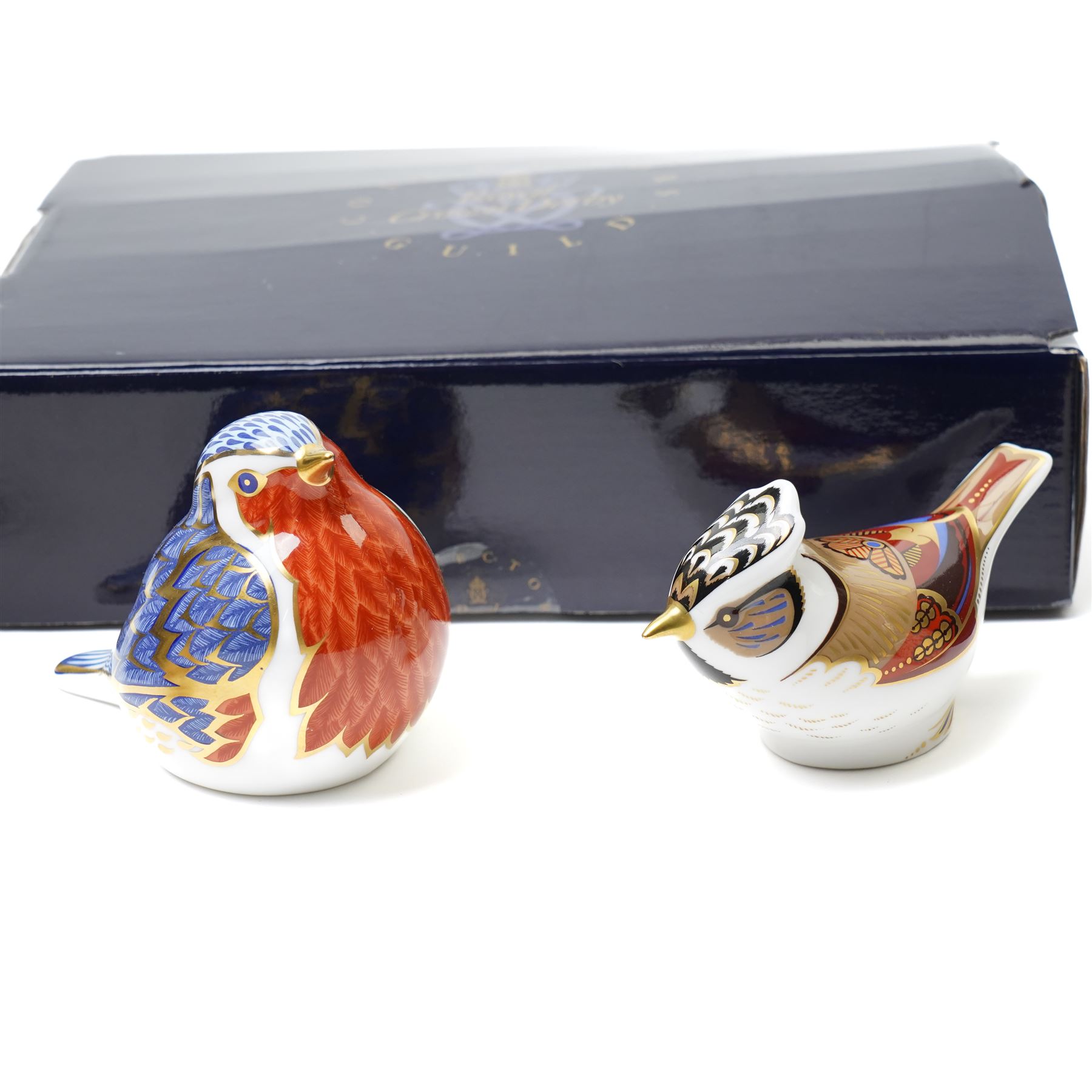 Six Royal Crown Derby paperweights, comprising Robin (unboxed), Robin nesting with gold stopper, Goldfinch nesting with gold stopper, Linnet with gold stopper, Tawny Owl with gold stopper and Crested Tit with gold stopper (6)