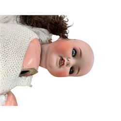 Two German porcelain dolls with moveable limbs