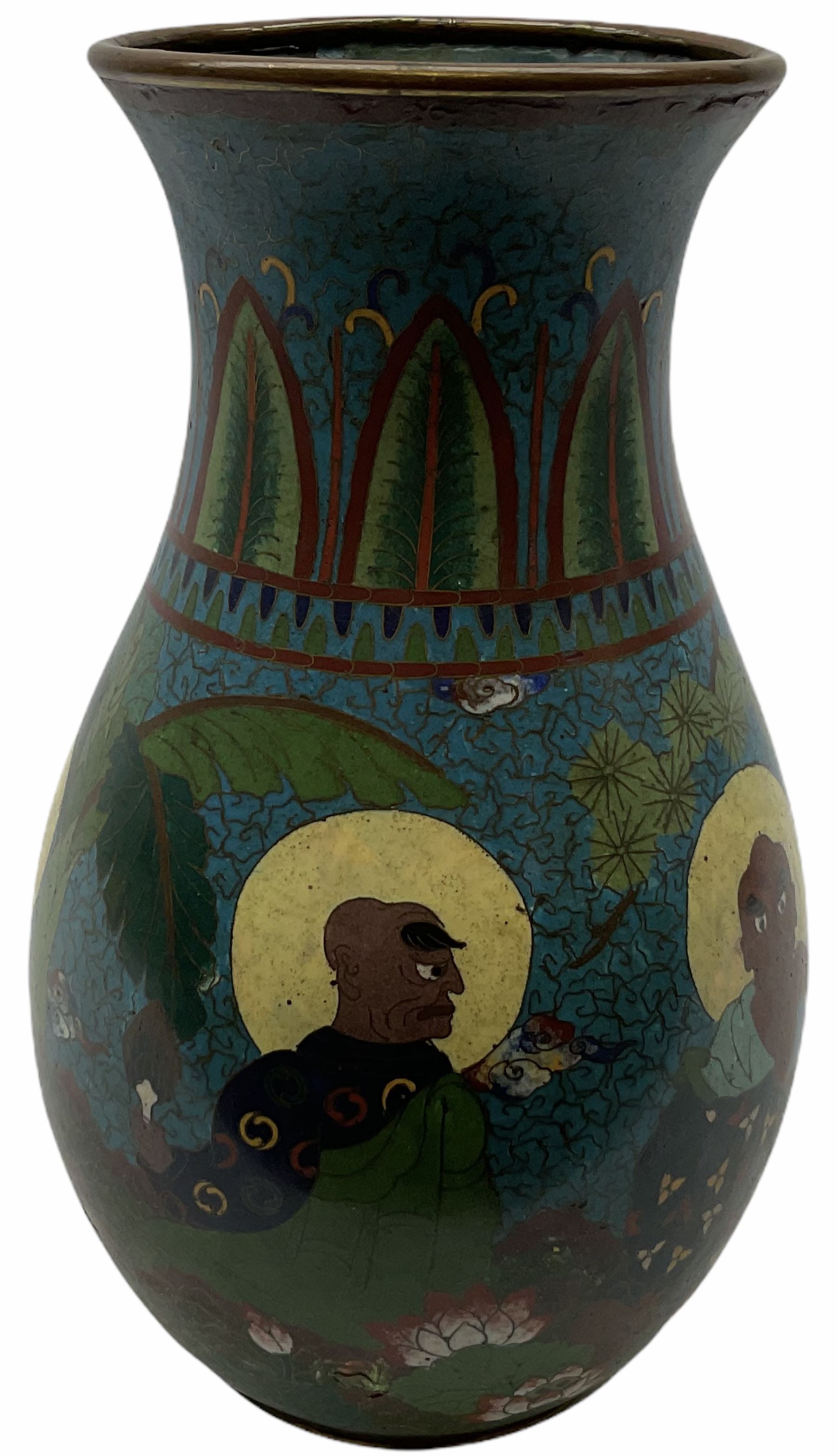 Japanese Cloisonne vase, Meiji/Taisho period, decorated with five haloed figures, possibly the Lucky Gods or Monks, in a landscape detailed with pine trees, lotus flowers and auspicious clouds, beneath a neck with band of fronds, with apocryphal Ming mark beneath, H31cm