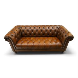 Barker and Stonehouse - traditional shape 'Ullswater' three seater Chesterfield club sofa, rolled back and arms upholstered in buttoned tan leather with studwork, raised on turned feet