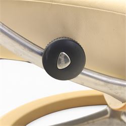 Ekornes - Stressless reclining beige leather armchair and stool, raised on brushed steel frame, light oak rotating base