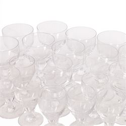 Georgian shaped drinking glasses, comprising eleven larger, H12.5cm, and eight smaller, H10.5cm, each with ovoid bowl upon knopped stem and circular foot