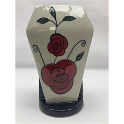 Charlotte Rhead for Crown Ducal ceramics, comprising coffin shaped vase depicting a woman in 1920s dress, a vase with handle, decorated with autumn leaves and a bowl, decorated with flowers and berries, with printed and signed marks beneath, coffin vase H24cm