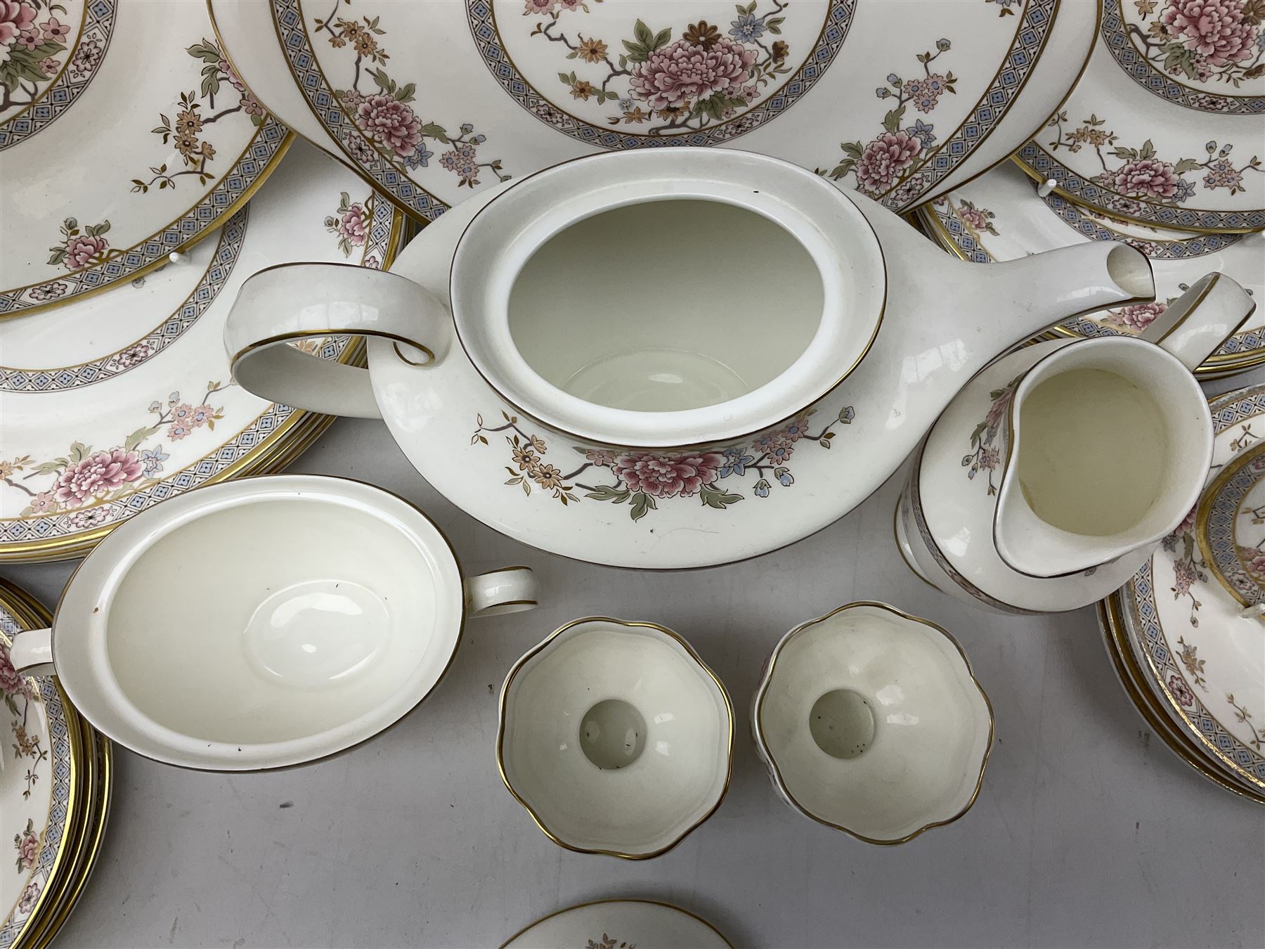 Royal Doulton Canton pattern tea and dinner wares comprising teapot, milk jug, twin handled lidded sucrier, cake plate, six dinner plates, six side plates, five smaller plates, five saucers and pair of candlestick holders, together with Sevres clear glass decanter with faceted sides and stopper, all with marks beneath