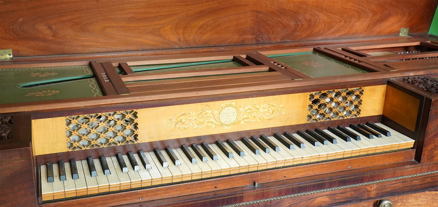Early 19th century George IV Square Piano by William Rolfe & Co, 112 Cheapside, London, c1821. Mahogany veneered case with rosewood crossbanding and brass stringing, with sustain pedal and reeded legs on a tapered spiral with brass capitals, with three music draws beneath and a folding duet music stand, nameboard with makers name on a round gilt medallion and open silk backed fretwork to the ends, serial No 6699, double strung, English double action with 68 ivory and ebony keys, F1-C7. original strings, hammers and dampers, soundboard and bridge in good condition, with original makers written instructions on regulating the action and tuning the piano attached to the inside of the instrument. In good condition, however the action is in need of regulation and tuning.
William Rolfe is thought to have been in business between 1785 and 1828. 
Given the intricate nature of these historic instruments, specialist support will be available if required, to assist successful buyers with safe removal and onward handling. Price upon application.


This item has been registered for sale under section 10 of the APHA Ivory Act Reference PB6GL6SZ