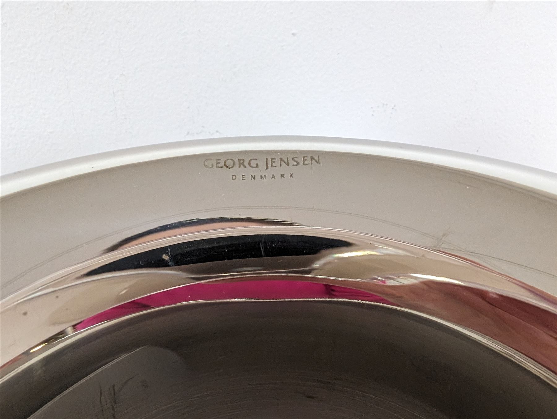 George Jensen stainless steel wine cooler, together with a silver plated pedestal dish, in the form of a clam shell and with squirrel decoration and four silver plated trinket dishes with applied pheasant decoration