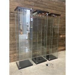 Three Ikea rosewood finish illuminated four glass shop display cabinets, with shelves and keys