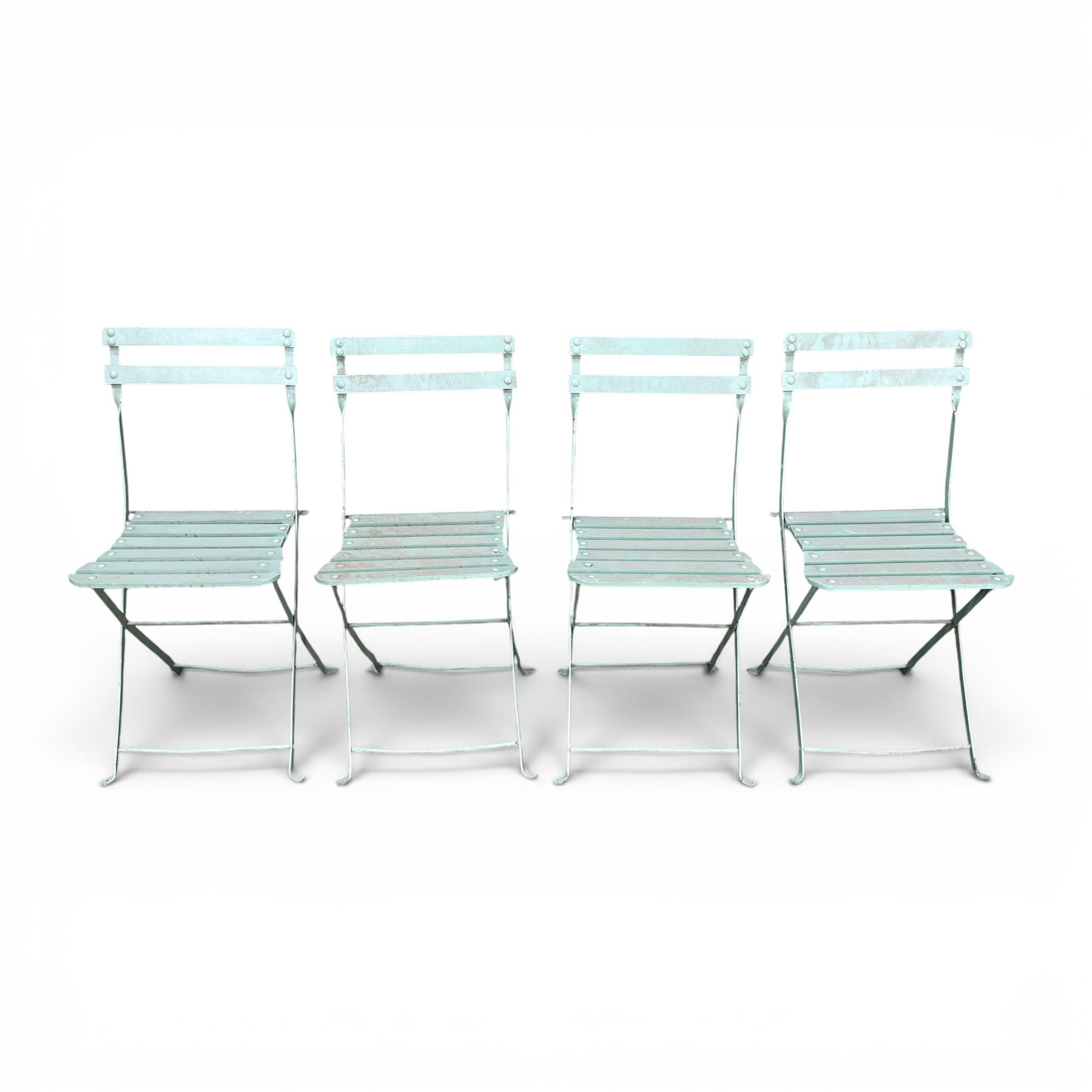 Wrought metal folding garden table, with painted wood plank top; and four matching folding chairs