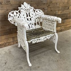 20th century Coalbrookdale design cast iron oak leaf and acorn armchair, white painted cast iron frame with slatted wooden seat, the pierced and shaped back decorated with scrolling oak branches and leafage, flanked by dog mask arm terminals over cabriole supports with paw feet